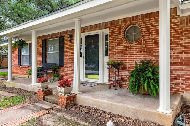 entrance to property featuring covered porch