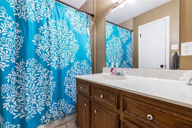 bathroom featuring tile patterned flooring and vanity