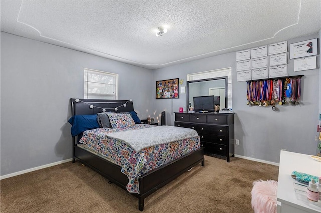 bedroom with carpet flooring and a textured ceiling