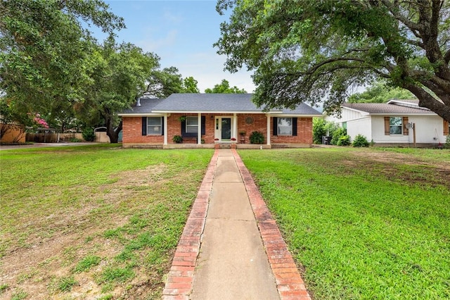 ranch-style home with a front lawn