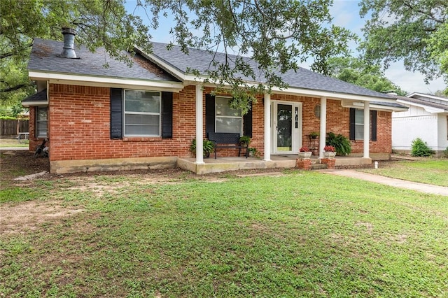 ranch-style house with a front lawn and covered porch