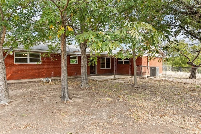 back of property with a patio