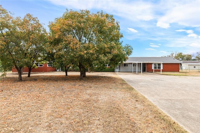 view of front of property with a carport