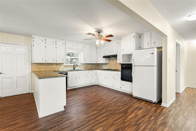 kitchen featuring oven, sink, dark hardwood / wood-style floors, white fridge, and white cabinetry