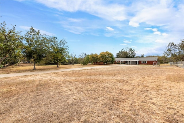 view of yard with a rural view