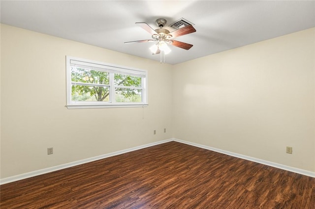 unfurnished room featuring ceiling fan and dark wood-type flooring