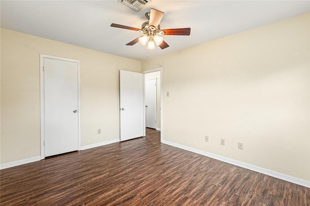 unfurnished bedroom featuring ceiling fan and dark wood-type flooring