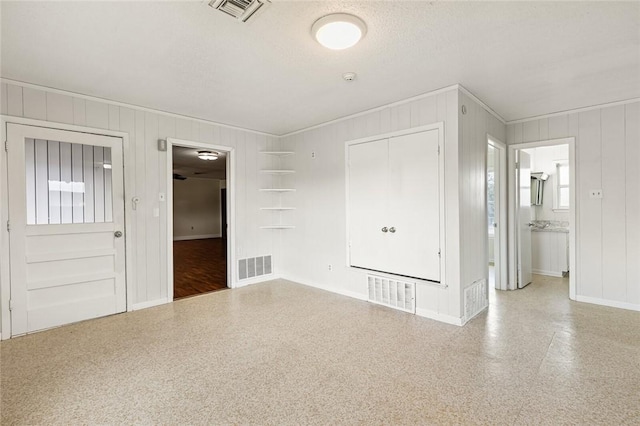 interior space featuring a textured ceiling