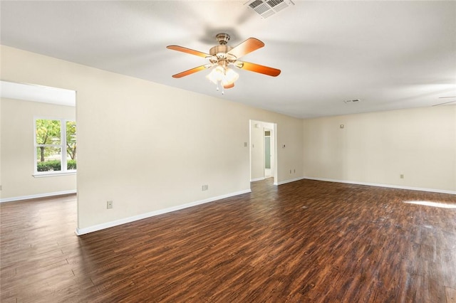 unfurnished room with ceiling fan and dark hardwood / wood-style flooring