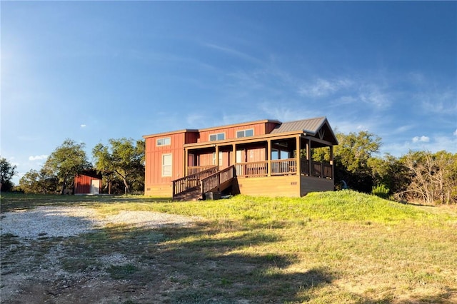 rear view of house with a lawn