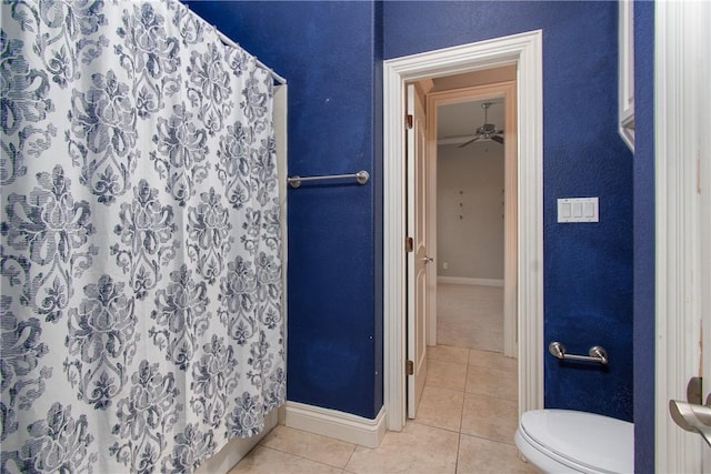 bathroom featuring tile patterned floors, ceiling fan, toilet, and walk in shower