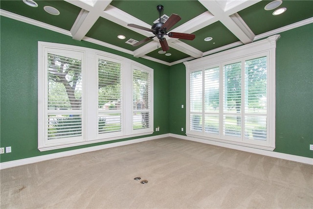 carpeted spare room featuring beam ceiling, ceiling fan, and crown molding