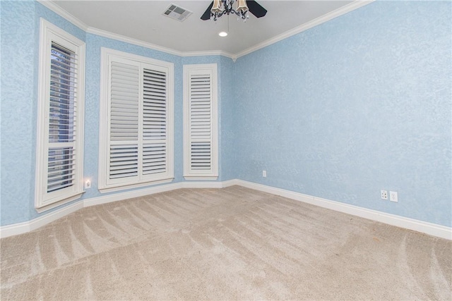 unfurnished room featuring carpet, ceiling fan, and crown molding