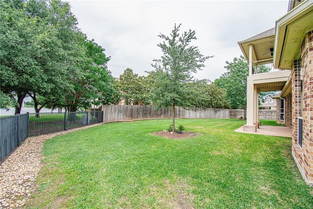 view of yard with a patio area and a balcony