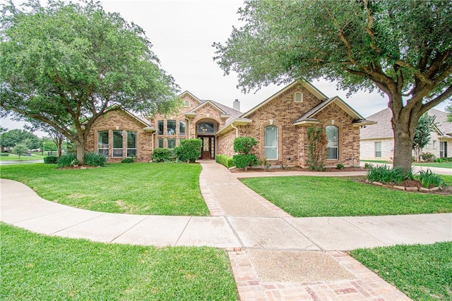 view of front of home featuring a front lawn