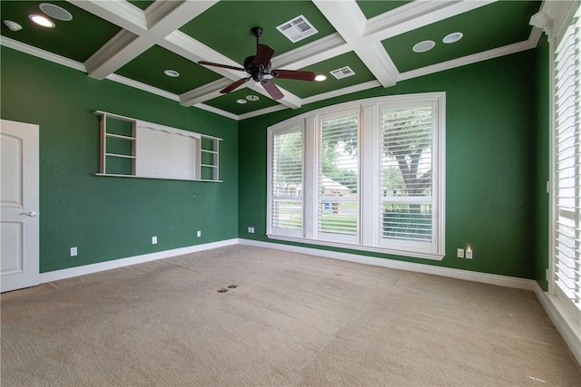 carpeted empty room with ceiling fan, a healthy amount of sunlight, and ornamental molding