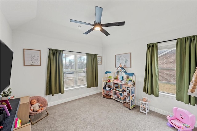 recreation room featuring ceiling fan, baseboards, vaulted ceiling, and carpet flooring