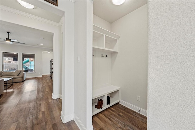 mudroom featuring ceiling fan, baseboards, ornamental molding, and dark wood finished floors