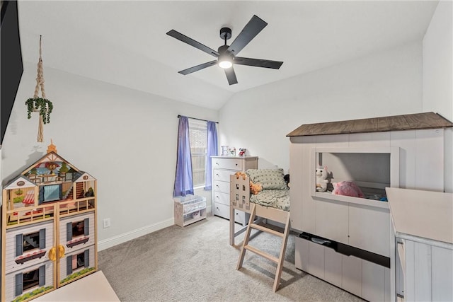 carpeted bedroom featuring baseboards, vaulted ceiling, and a ceiling fan