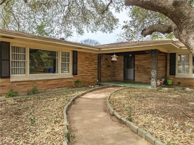 ranch-style house with brick siding