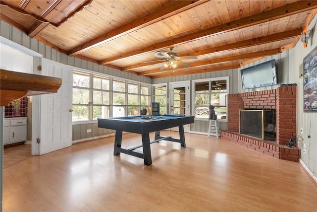 rec room with billiards, wood ceiling, wood finished floors, a fireplace, and beam ceiling