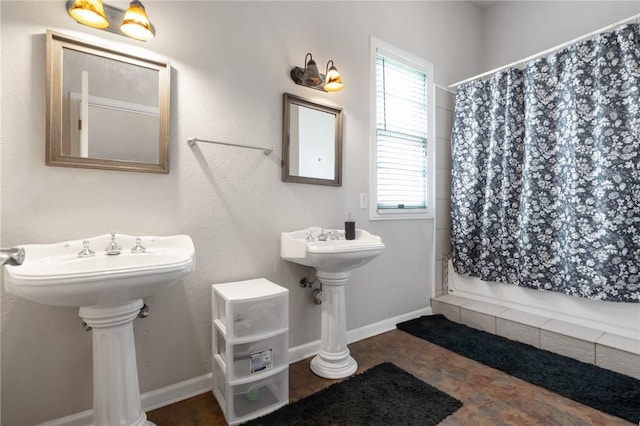 full bathroom featuring shower / bathtub combination with curtain and baseboards