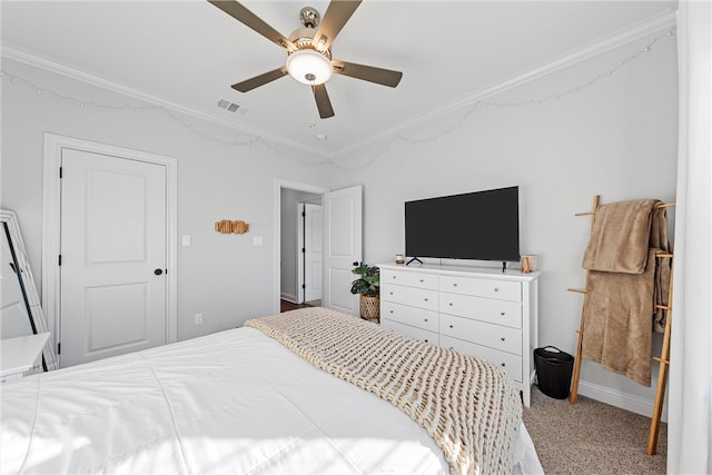 carpeted bedroom with crown molding, a ceiling fan, and visible vents