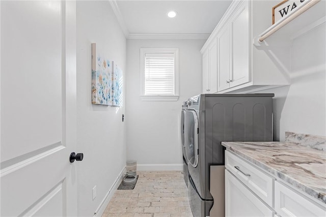 laundry area with baseboards, recessed lighting, cabinet space, ornamental molding, and washer and clothes dryer