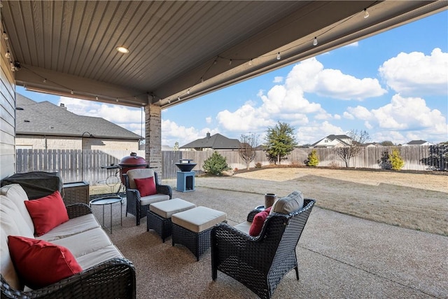 view of patio with an outdoor hangout area and a fenced backyard