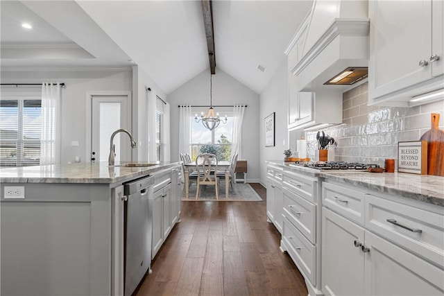 kitchen with dark wood-type flooring, a sink, appliances with stainless steel finishes, decorative backsplash, and custom exhaust hood