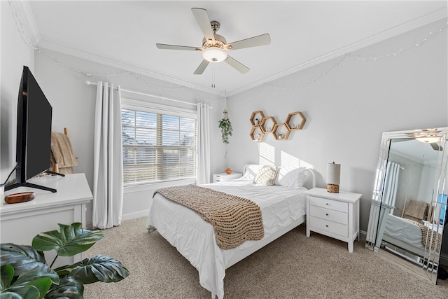 bedroom with a ceiling fan, crown molding, and light colored carpet