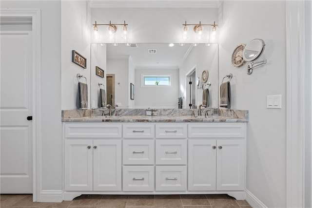 bathroom with double vanity, ornamental molding, visible vents, and a sink