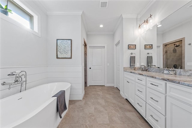 bathroom featuring visible vents, crown molding, a freestanding bath, a stall shower, and vanity