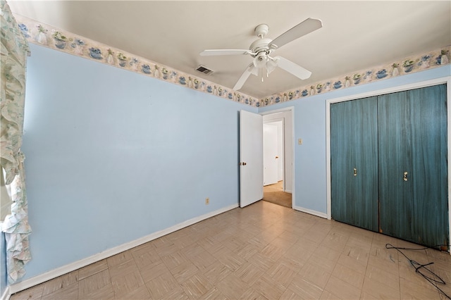 unfurnished bedroom featuring ceiling fan and a closet