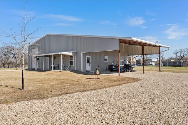 view of outbuilding featuring a carport