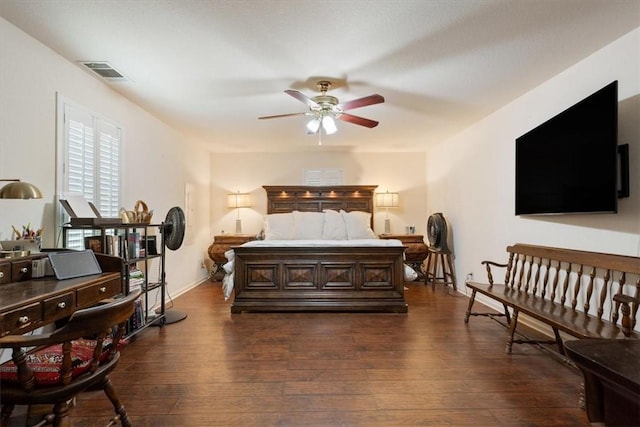 bedroom featuring ceiling fan and dark hardwood / wood-style floors