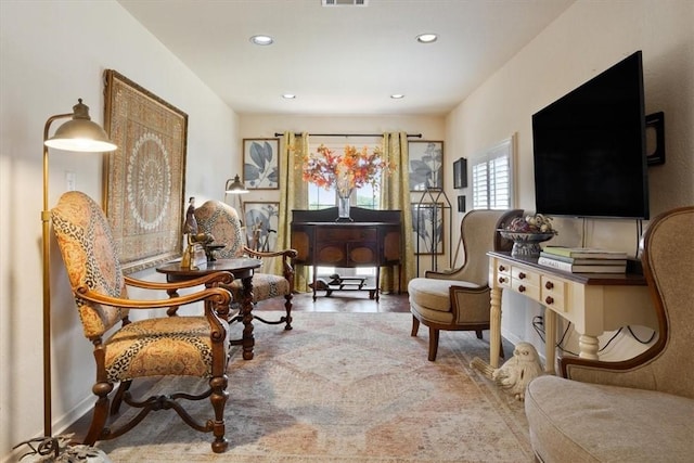 living area with hardwood / wood-style flooring