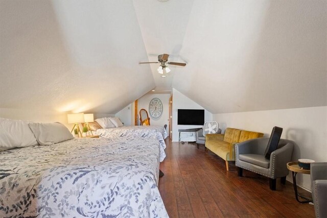 bedroom featuring ceiling fan, lofted ceiling, and dark wood-type flooring