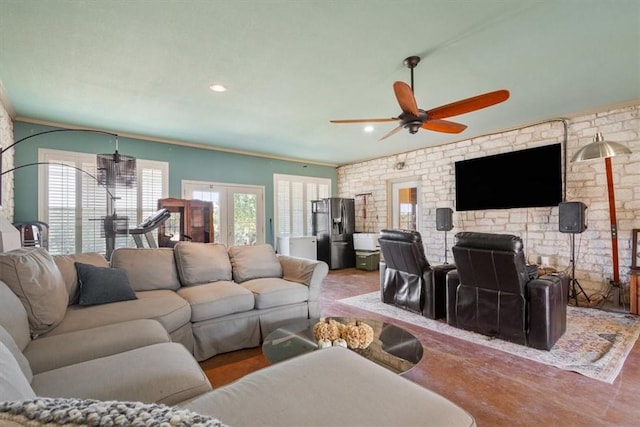 living room featuring ceiling fan, french doors, and ornamental molding