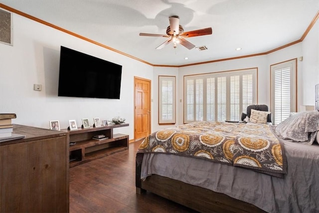 bedroom with dark hardwood / wood-style floors, ceiling fan, and crown molding