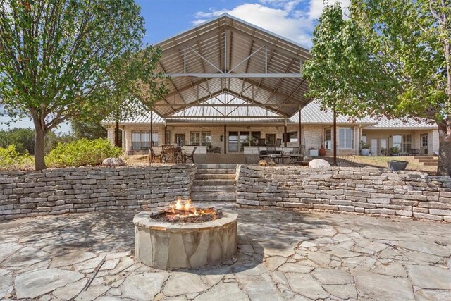 view of patio featuring a fire pit