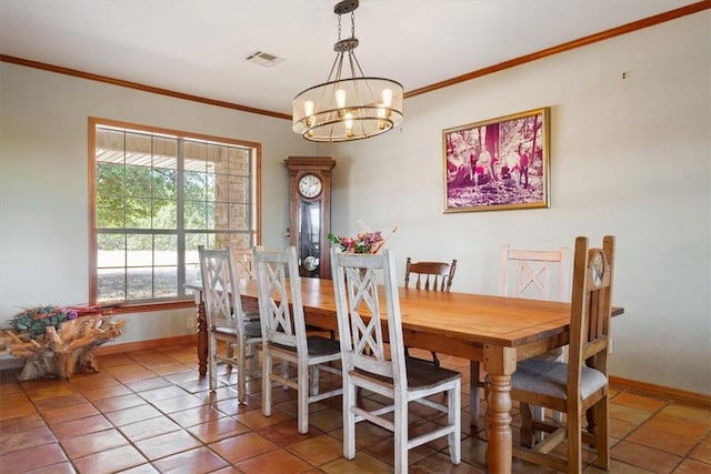 dining space featuring crown molding, tile patterned flooring, and an inviting chandelier