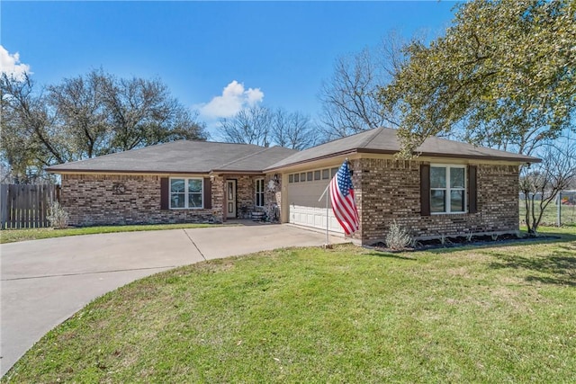 single story home featuring a front lawn, driveway, fence, a garage, and brick siding