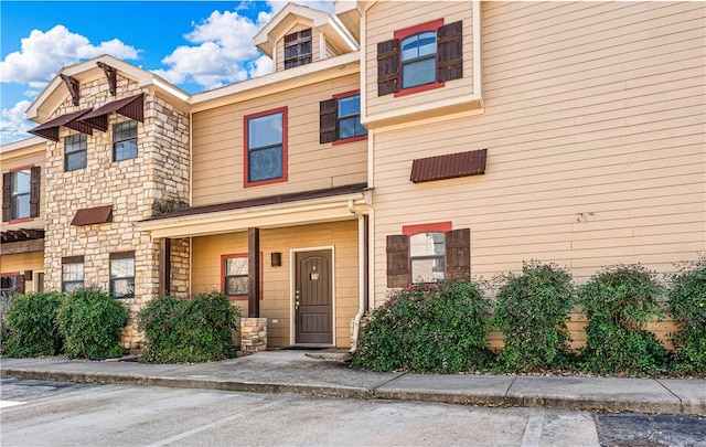 multi unit property with stone siding