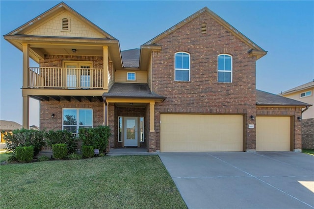 view of front of house with a front yard, a balcony, and a garage