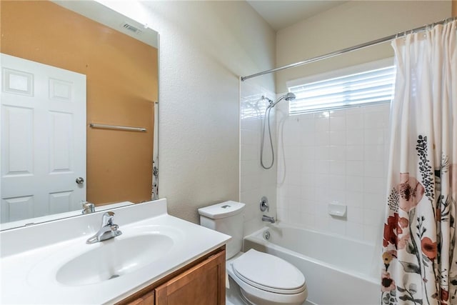 full bathroom featuring vanity, toilet, and shower / bath combo with shower curtain