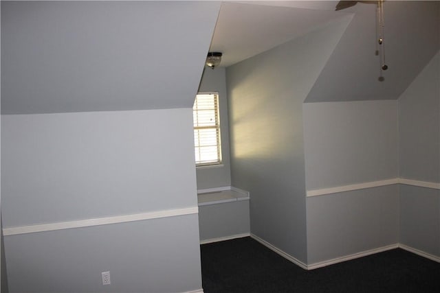 bonus room with carpet and vaulted ceiling