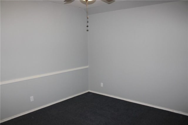 spare room featuring ceiling fan and carpet floors