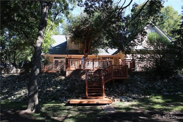 rear view of house with a wooden deck