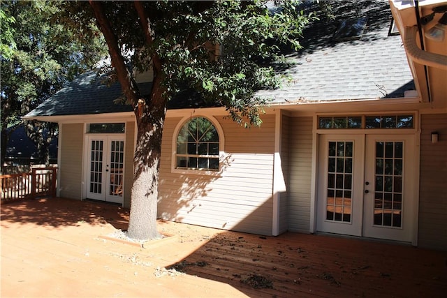 property entrance with french doors and a wooden deck